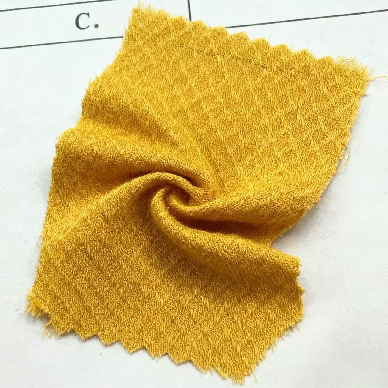60-count artificial cotton jacquard ginger yellow texture, soft skin, breathable, fine texture. Factory custom-made artificial cotton fabric, minimum order 50 meters, suitable for shirts/dresses. Spring and summer fabric, comfortable and skin-friendly