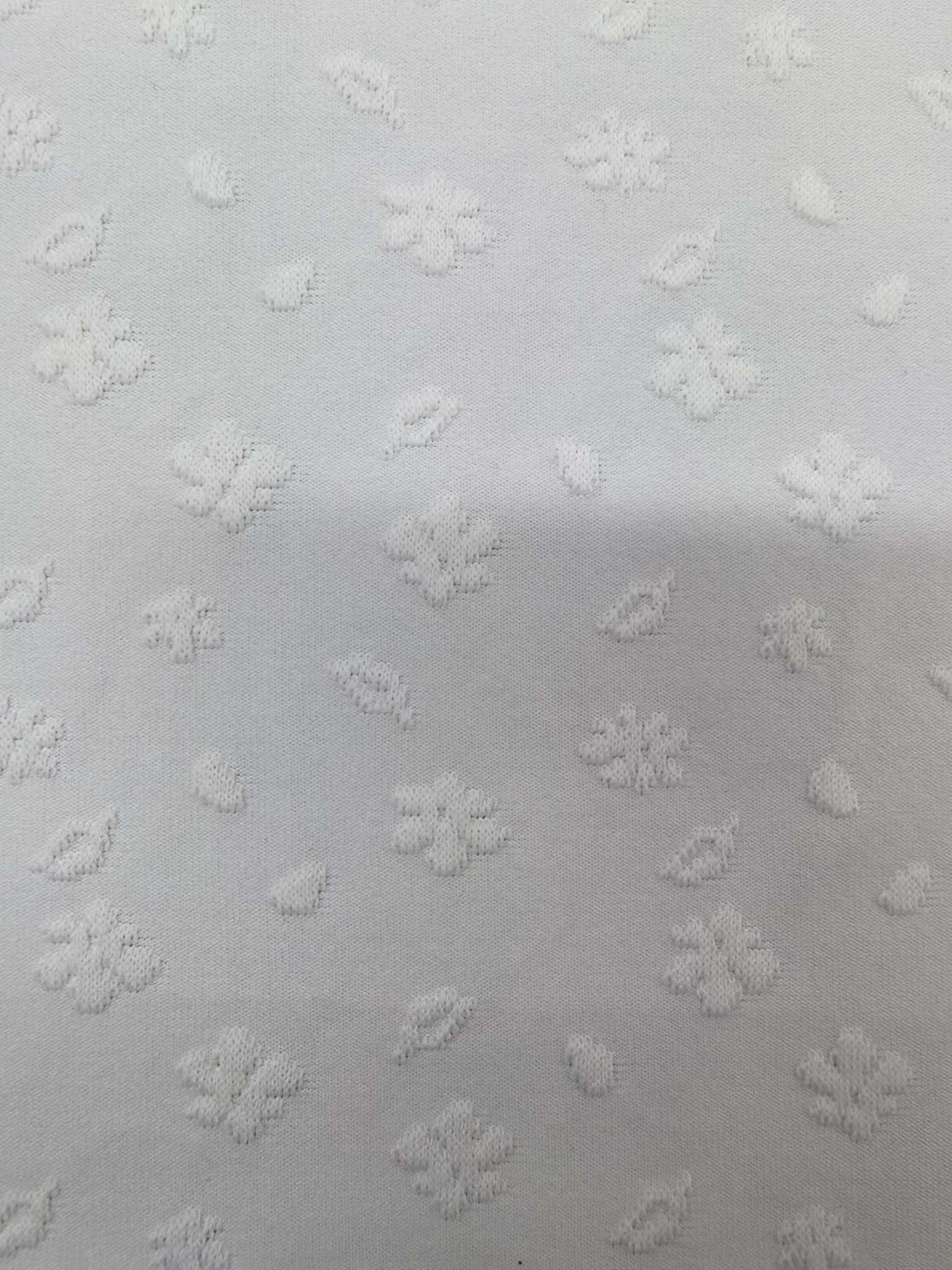 WKA90632 Cool Silk cotton knitted fine-needle double-sided jacquard fabric has a soft hand feel and is suitable for underpants, base shirts, pillowcases, with a strong three-dimensional effect. It is independently innovated and developed in a targeted manner, and can be customized based on samples