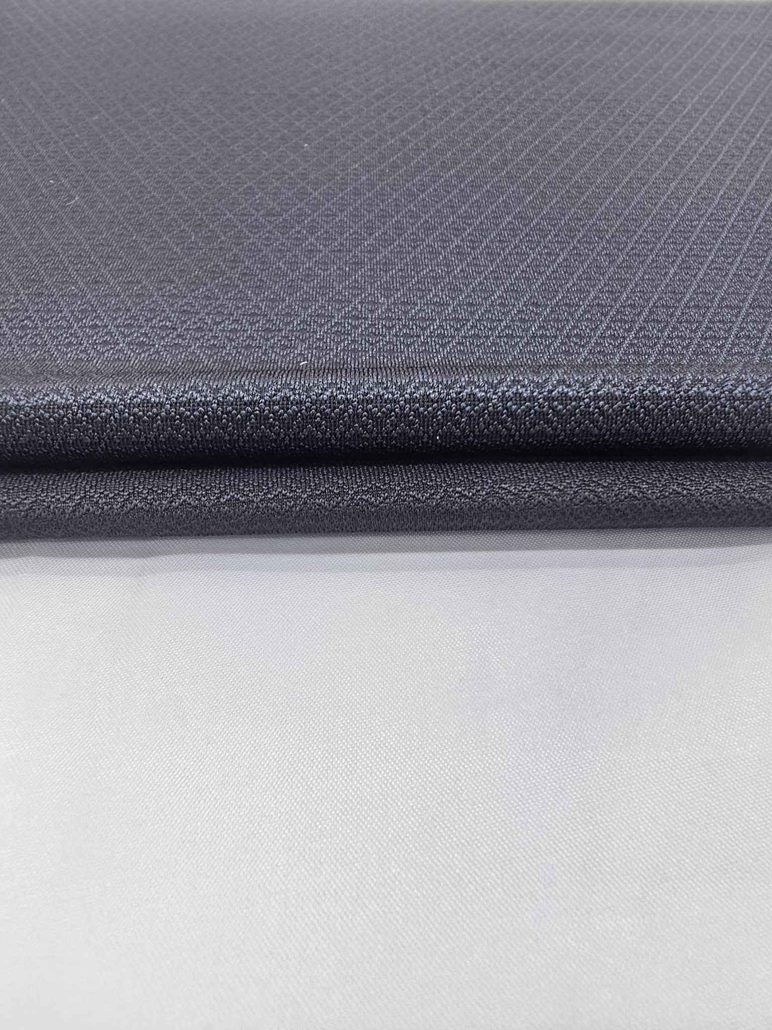 KWA90893 nylon knitted close-knit jacquard fabric is suitable for business men's T-shirts, straight-leg pants, and slightly flared pants. It is skin-friendly, soft, and has a strong icy feel. The new summer style has a vertical feel that is fully developed through independent innovation Specification image