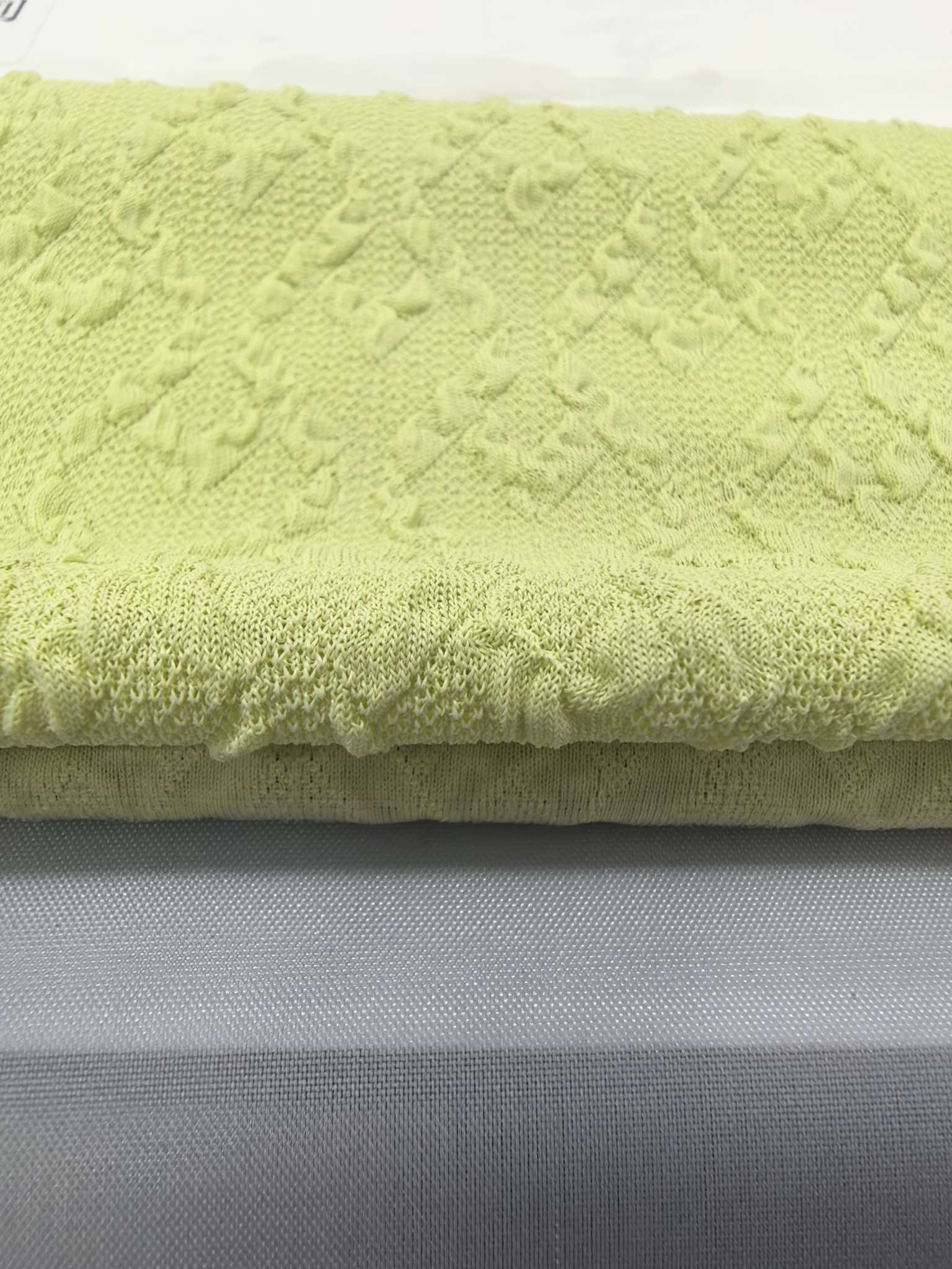 KWA90341 jacquard knitted fabric with fine stitches and wrinkled fabric is designed for women's underwear and hair bands. It features three-dimensional softness and is independently developed and customized based on samples Specification image