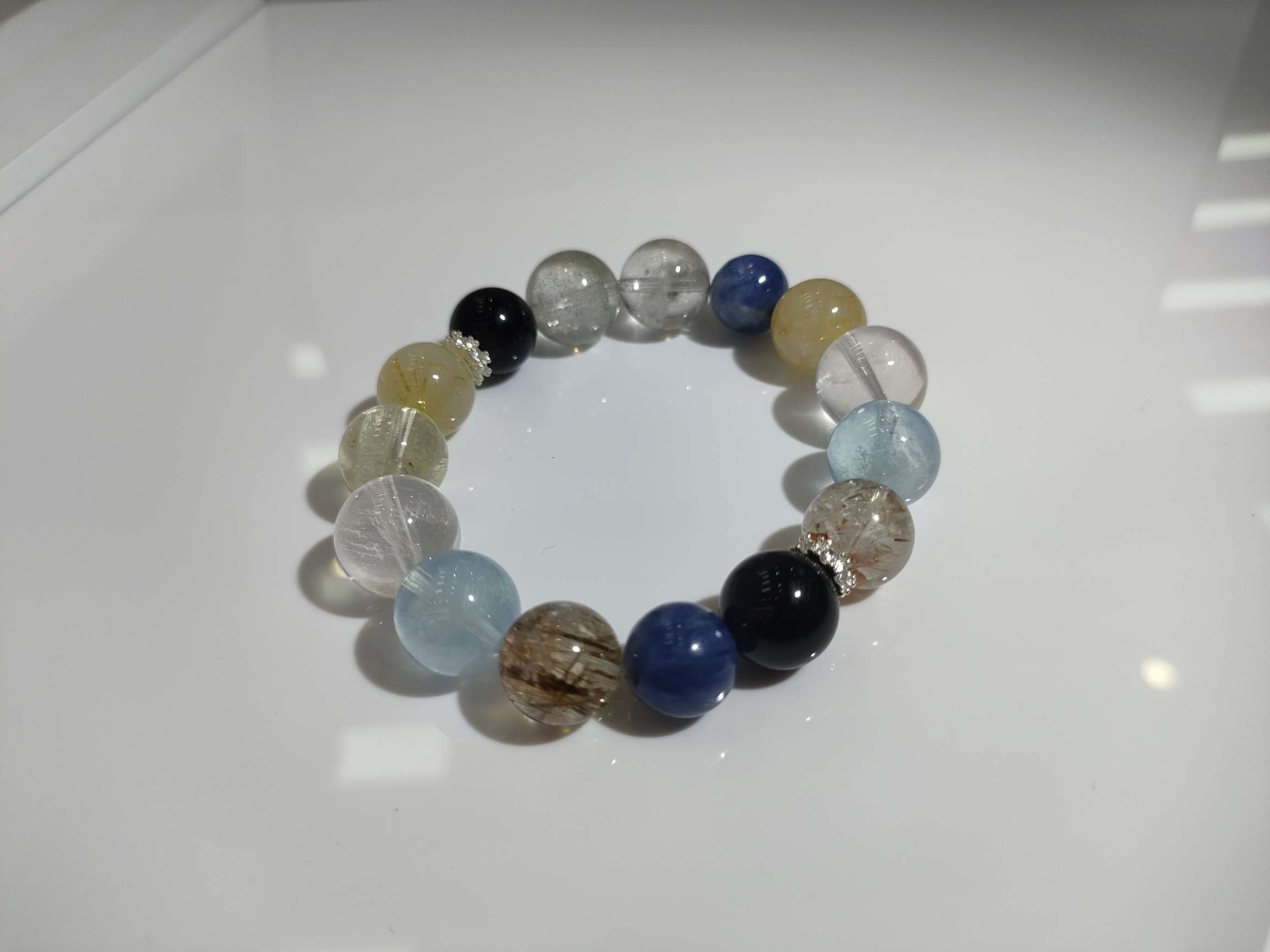 海蓝宝+奶白晶+黄塔晶+蓝晶石+碧玺绿发晶+金运石+黄水晶+金发晶+黑金超七18mm详情图2