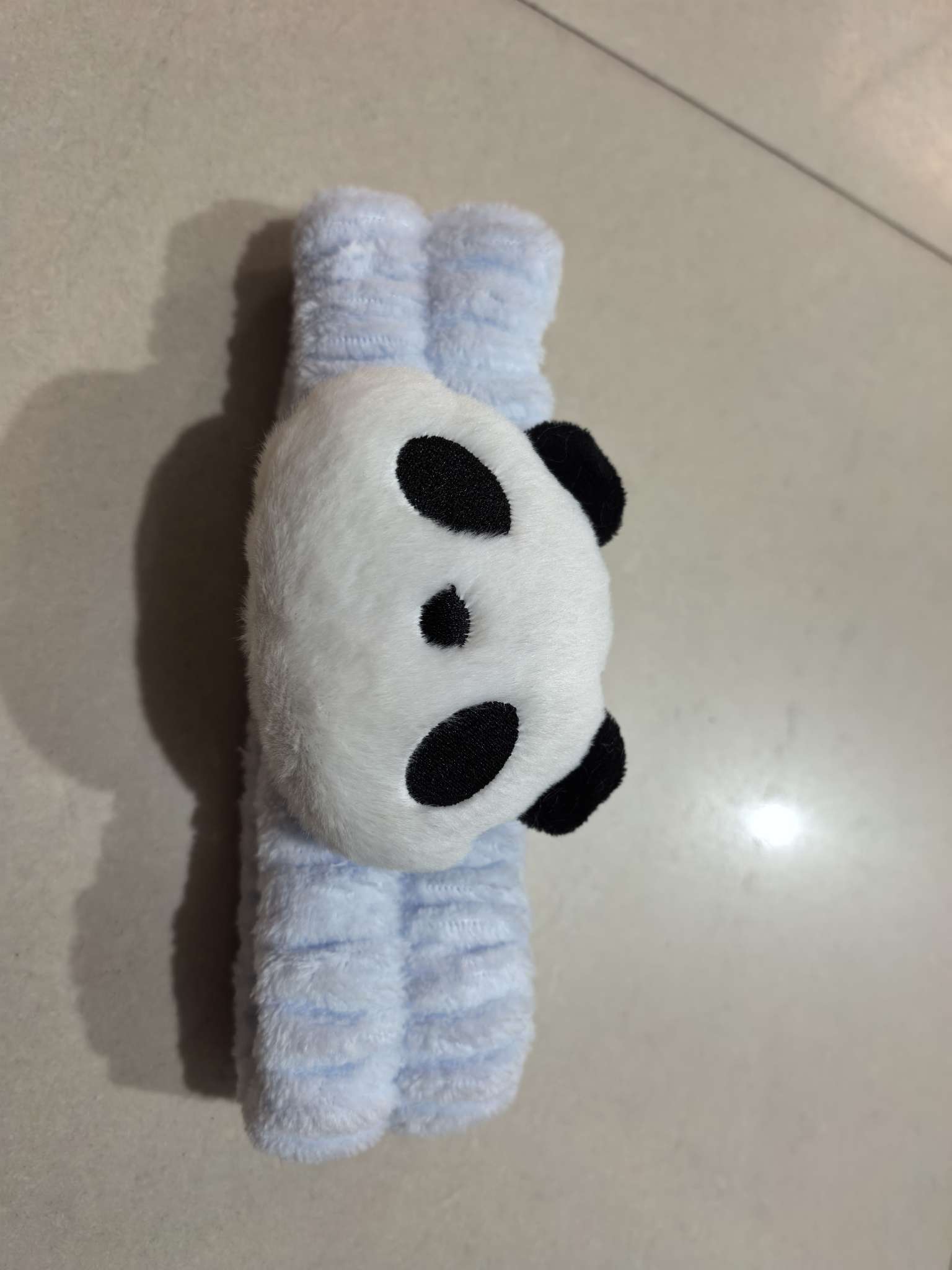 The cute and trendy hair band, featuring a cartoon panda and a beautiful blue hair band, is super pretty and good-looking