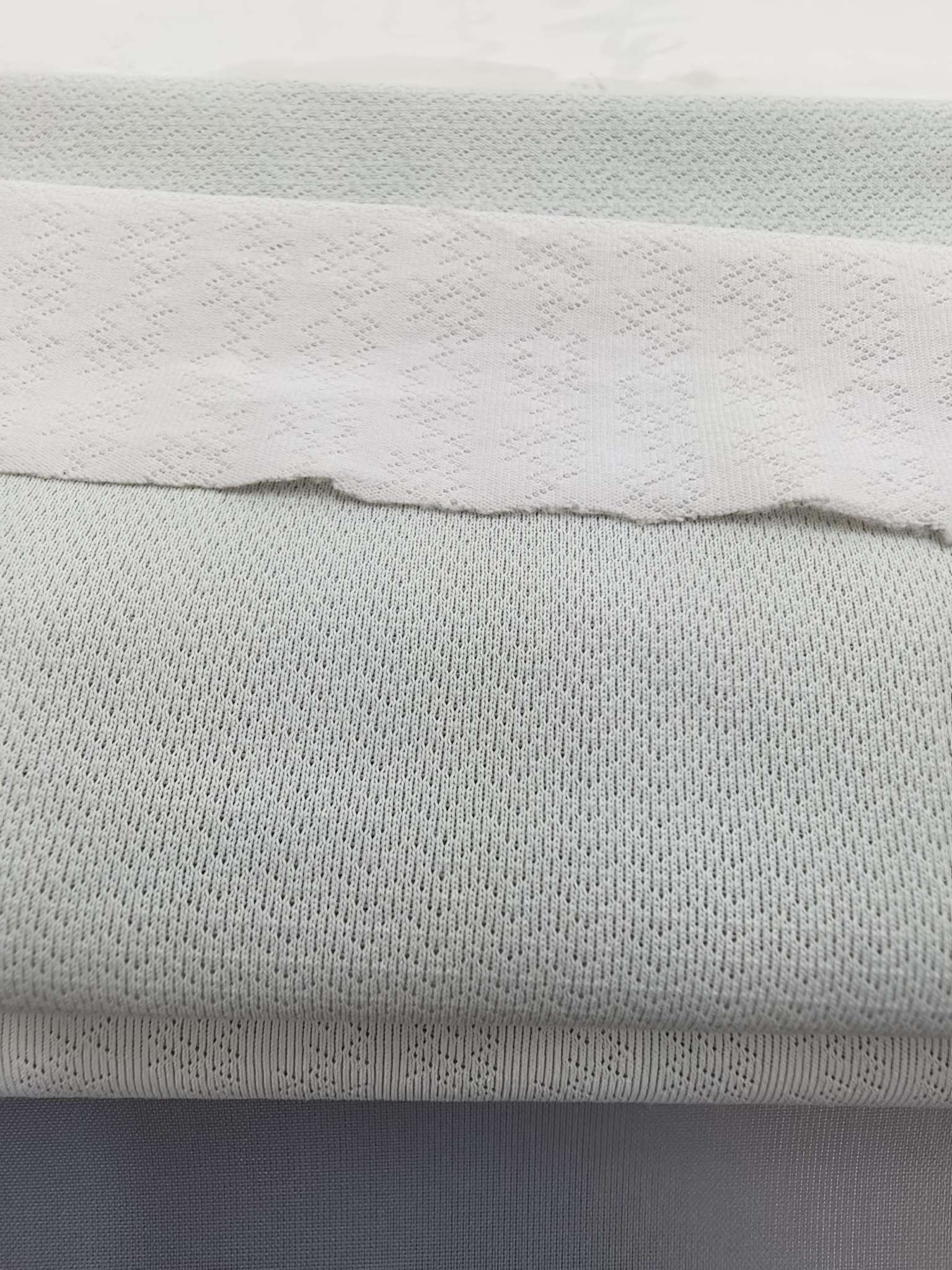 WKA90673 polyester knitted close-knit jacquard fabric is skin-friendly and soft, suitable for men's T-shirts and men's underwear. It is independently innovated, developed and customized based on samples detail image 3