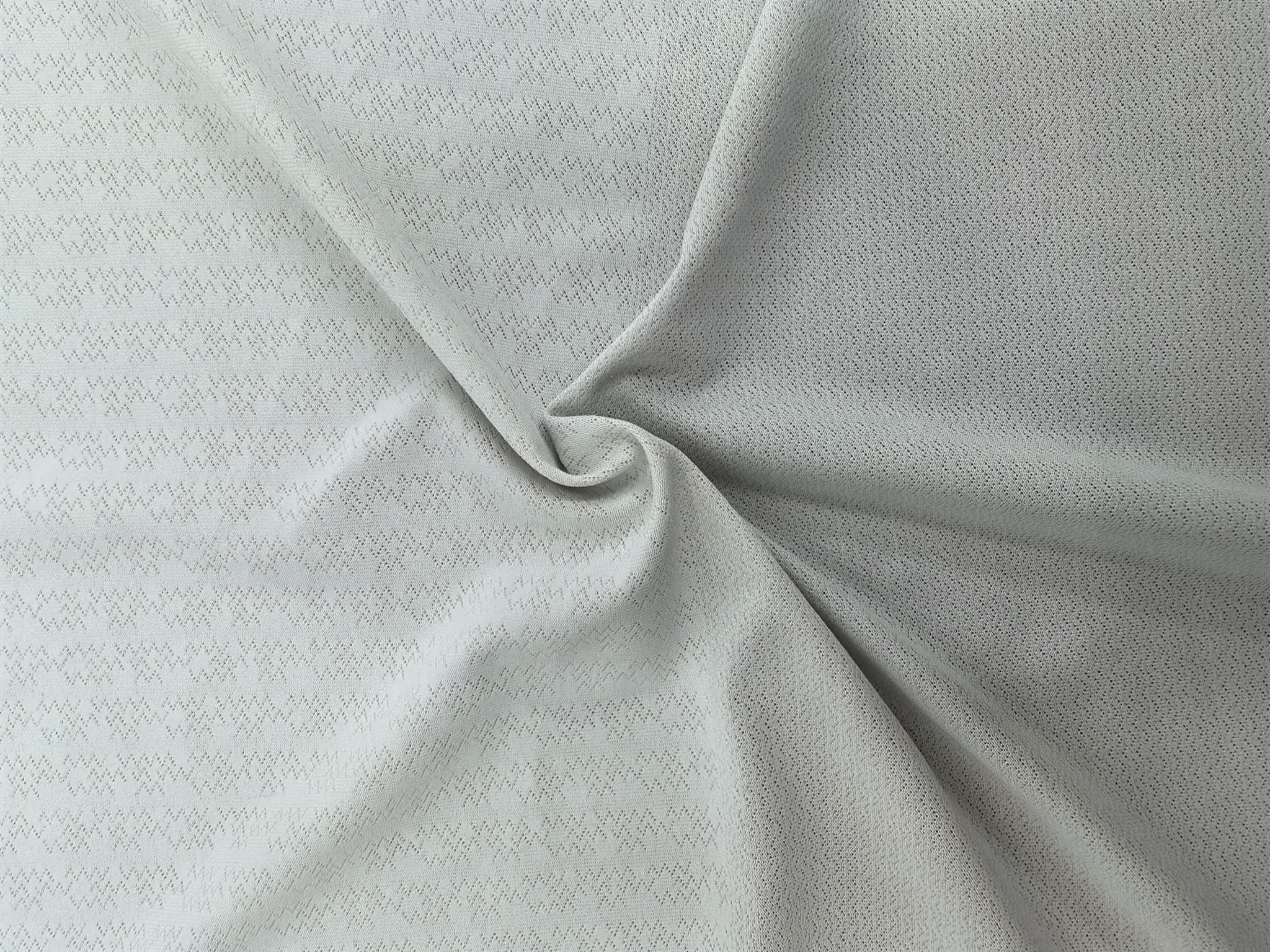 WKA90673 polyester knitted close-knit jacquard fabric is skin-friendly and soft, suitable for men's T-shirts and men's underwear. It is independently innovated, developed and customized based on samples Item Picture