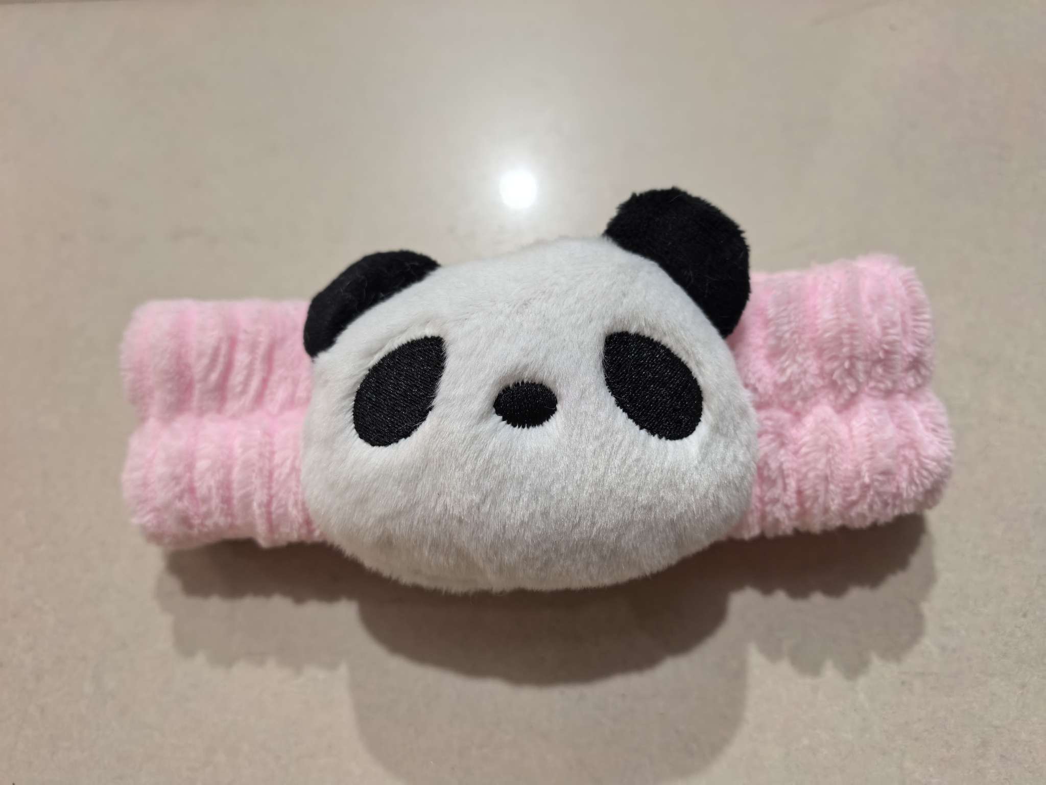 The cute and trendy hair band featuring a cartoon panda and a beautiful pink hair band is super pretty and good-looking