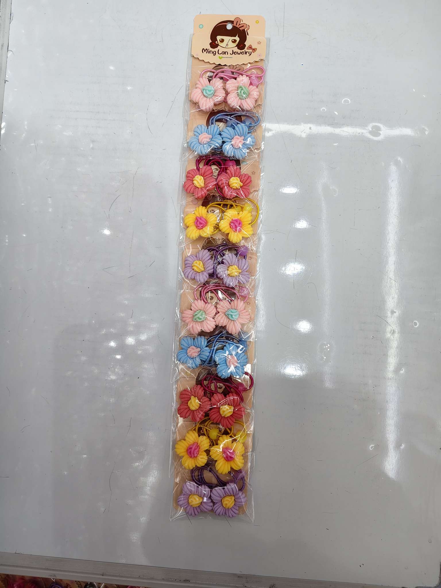 最近流行款式条纹花朵中间带着花球皮筋茗兰饰品3007B