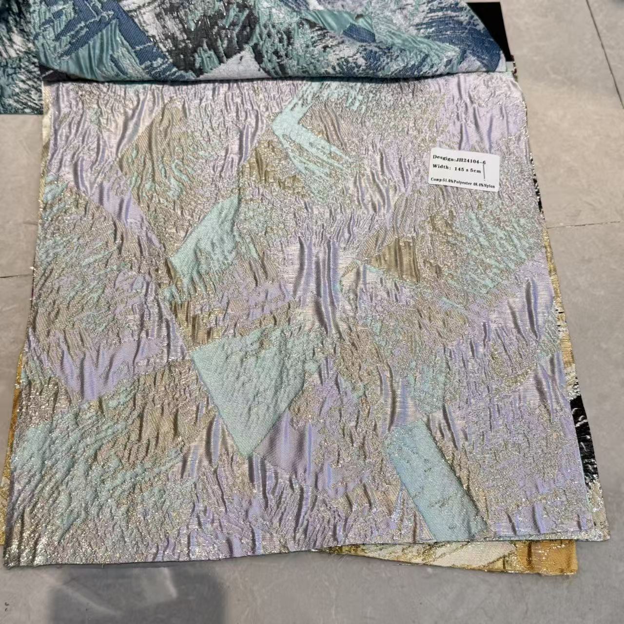 高精密不规则闪光亮丝立体浮雕蓝金撞色羽毛色织提花面料时装礼服连衣裙半裙伞裙外套布料详情3