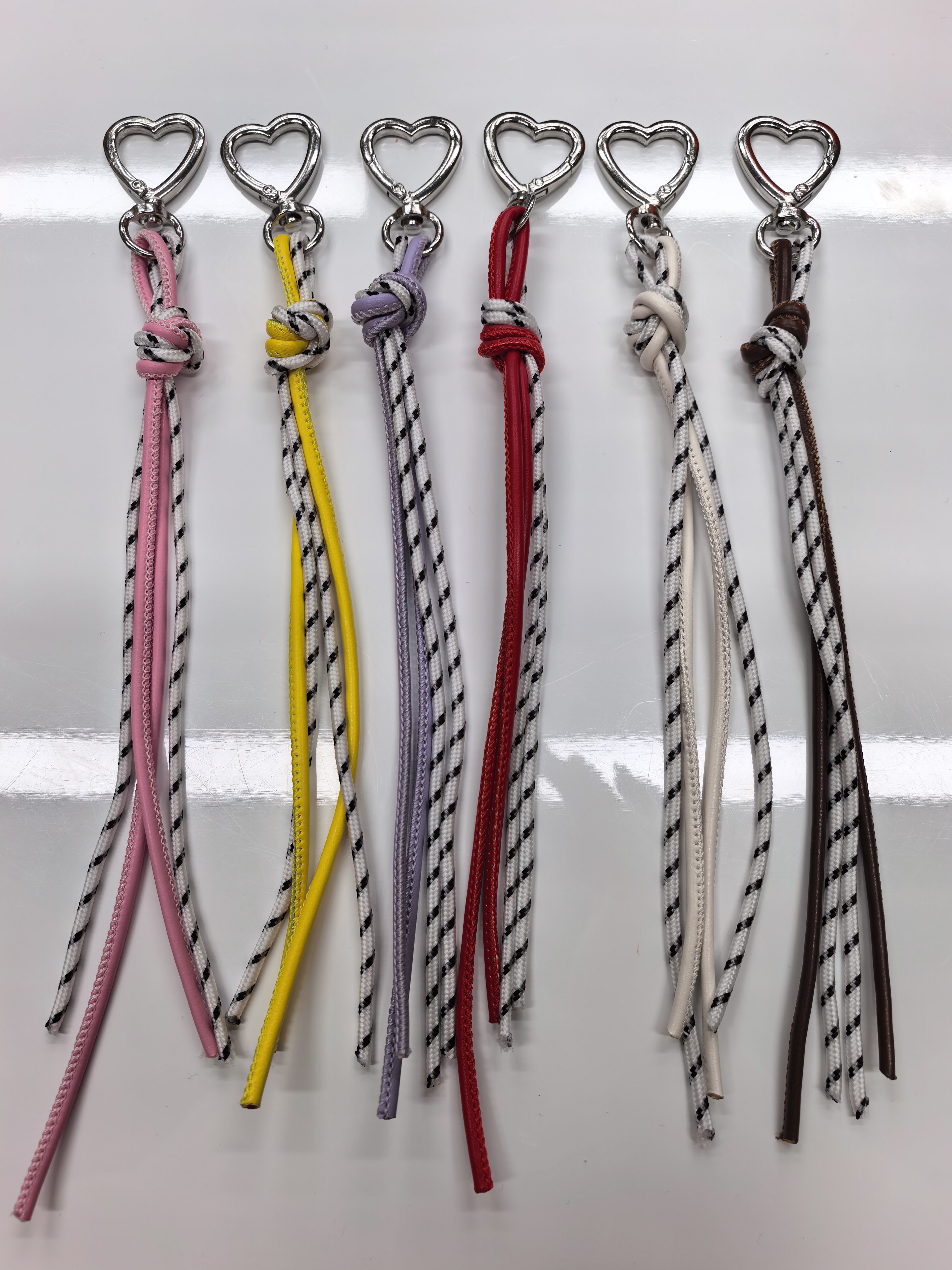 The new woven leather rope keychain pendant is simple and versatile. It is a MIU-style bag accessory and a short mobile phone lanyard detail image 6