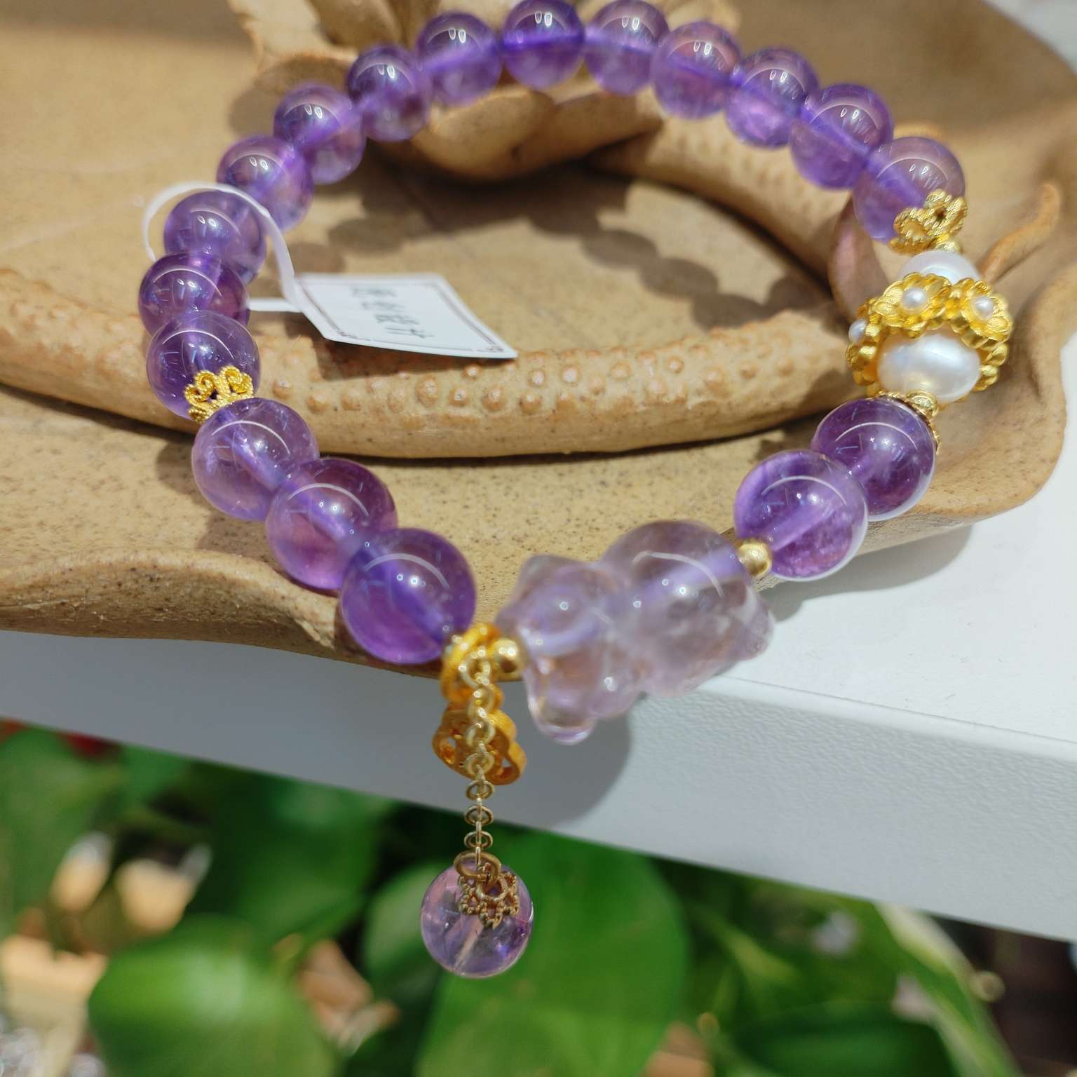 8mm natural amethyst bracelet paired with pearl bracelet is a fashionable and versatile accessory for women. It features a simple and trendy look with an elegant style detail image 6