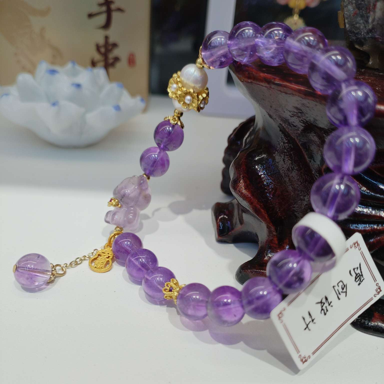 8mm natural amethyst bracelet paired with pearl bracelet is a fashionable and versatile accessory for women. It features a simple and trendy look with an elegant style details Picture