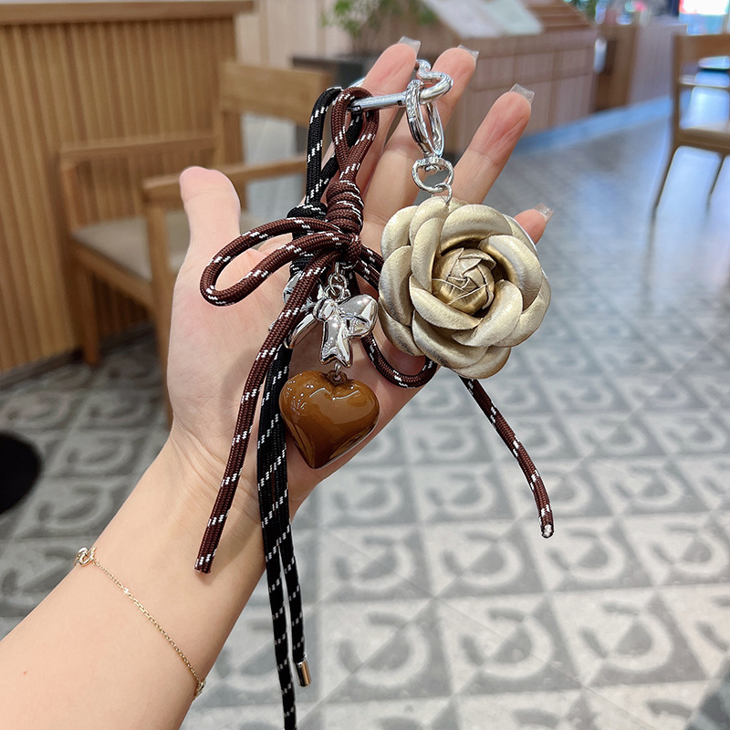 Fashionable and creative Korean-style camellia hand-woven rope heart keychain decorative pendant, car key chain, bag pendant detail image 3