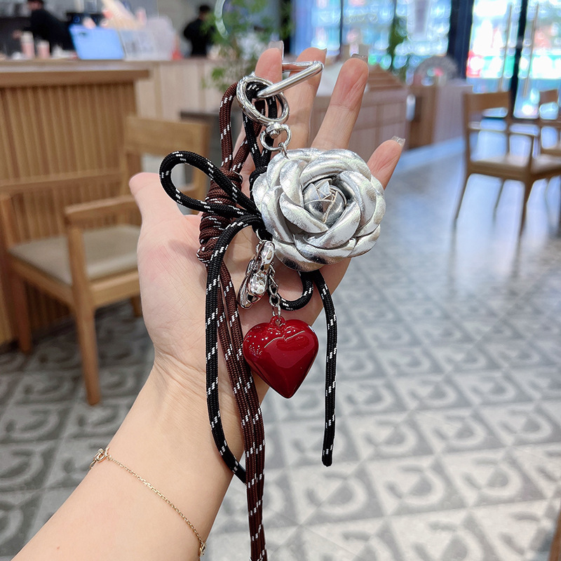 Fashionable and creative Korean-style camellia hand-woven rope heart keychain decorative pendant, car key chain, bag pendant Application Scenario