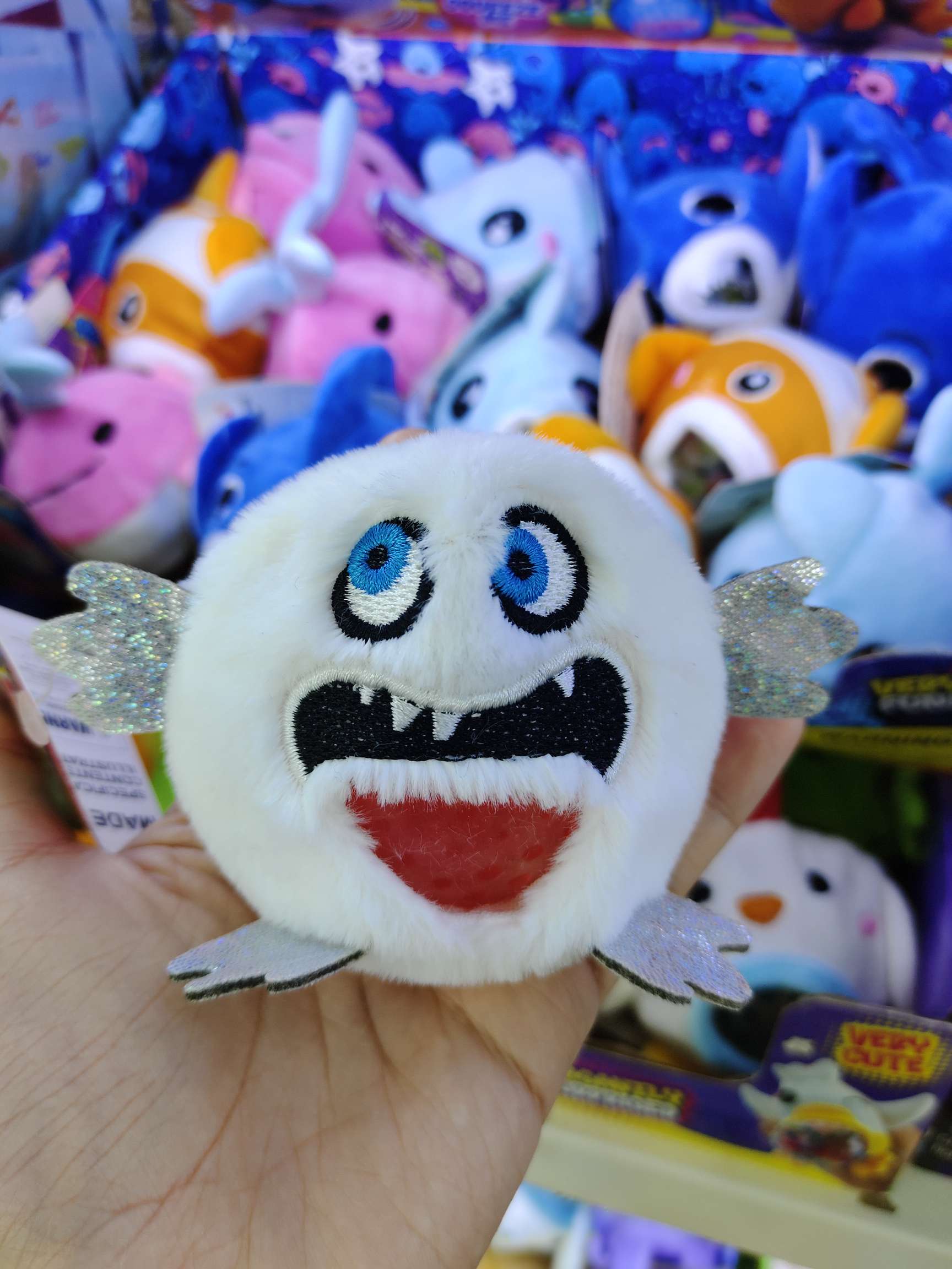 Cute plush stress-relieving pinching ball plush toy, monster series bead-spitting toy, stress-relieving toy, creative and trendy toy display box packaging detail image 3