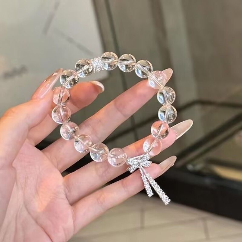 Light luxury ice-transparent white crystal slightly inlaid bow ribbon bracelet with a cold and elegant feminine touch, exquisite and super fairy-like beaded jewelry crystal