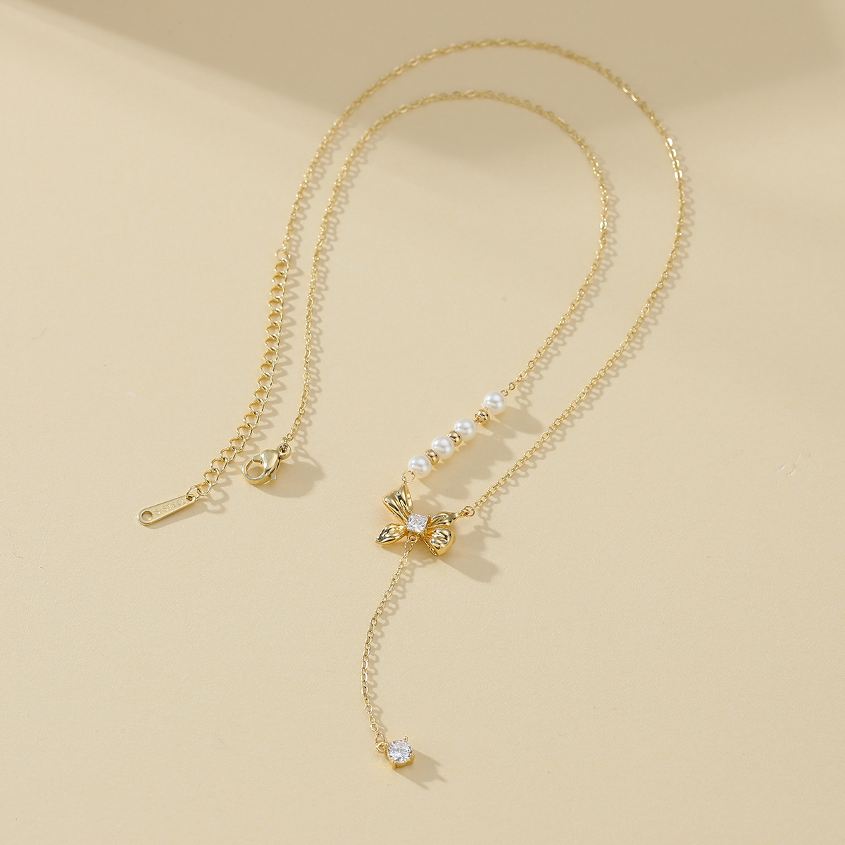 Xuhui brand exquisite and light luxury copper-plated real gold and zircon inlaid bow necklace, fashionable and elegant, versatile Specification drawing