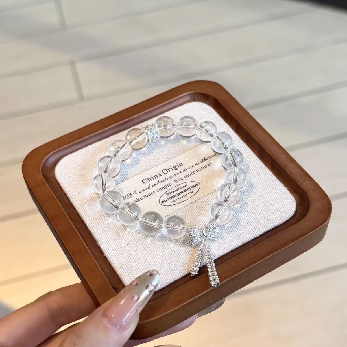 Light luxury ice-transparent white crystal slightly inlaid bow ribbon bracelet with a cold and elegant feminine touch, exquisite and super fairy-like beaded jewelry crystal Application Scenario