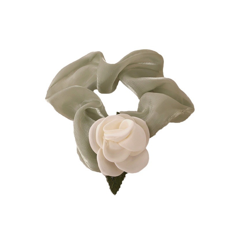 The forestle-style large intestine hair tie exudes a sense of sophistication for women. The camellia hair tie is tied with a hair band, presenting a simple and elegant French style Item Picture
