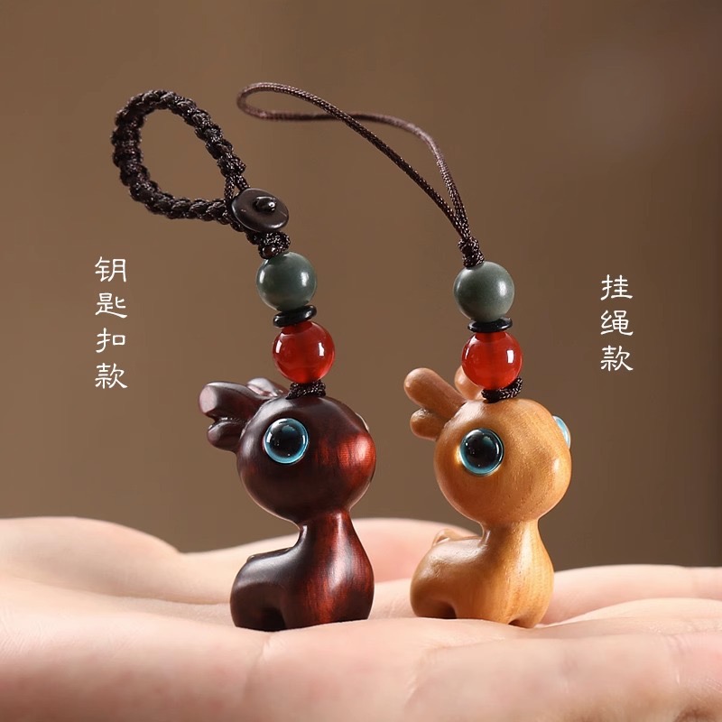Wholesale of rosewood, green rosewood, black rosewood and Barbie rosewood carved deer keychain bags details Picture