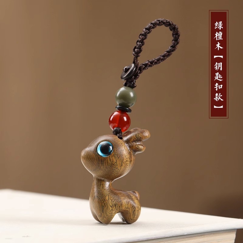 Wholesale of rosewood, green rosewood, black rosewood and Barbie rosewood carved deer keychain bags Item Picture