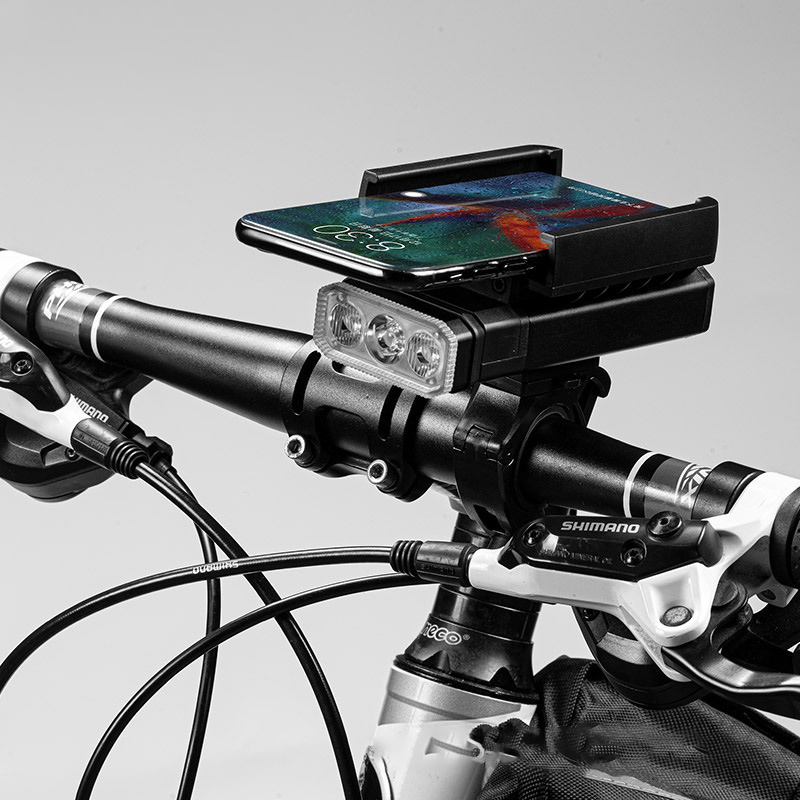 The T6 cycling lamp is a rechargeable outdoor multi-functional device with a phone stand, power bank, bicycle headlight and flashlight The T6 cycling lamp is a rechargeable outdoor multi-functional device with a phone stand, power bank, bicycle headlight and flashlight