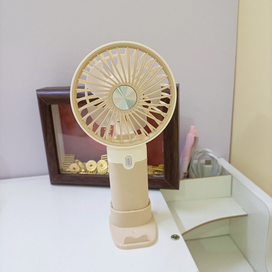 The new simple and mini handheld fan has a strong wind force and can be charged by USB. It is a portable desktop stand for outdoor students Specification drawing