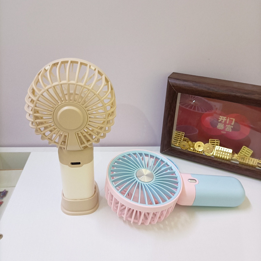The new simple and mini handheld fan has a strong wind force and can be charged by USB. It is a portable desktop stand for outdoor students Specification drawing