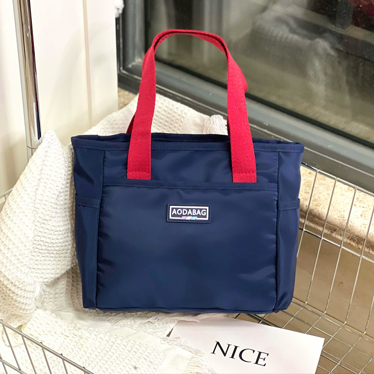 new contrast color korean style niche handbag work commuter hand carrying file snack sundry bag lunch bag mummy bag Application Scenario