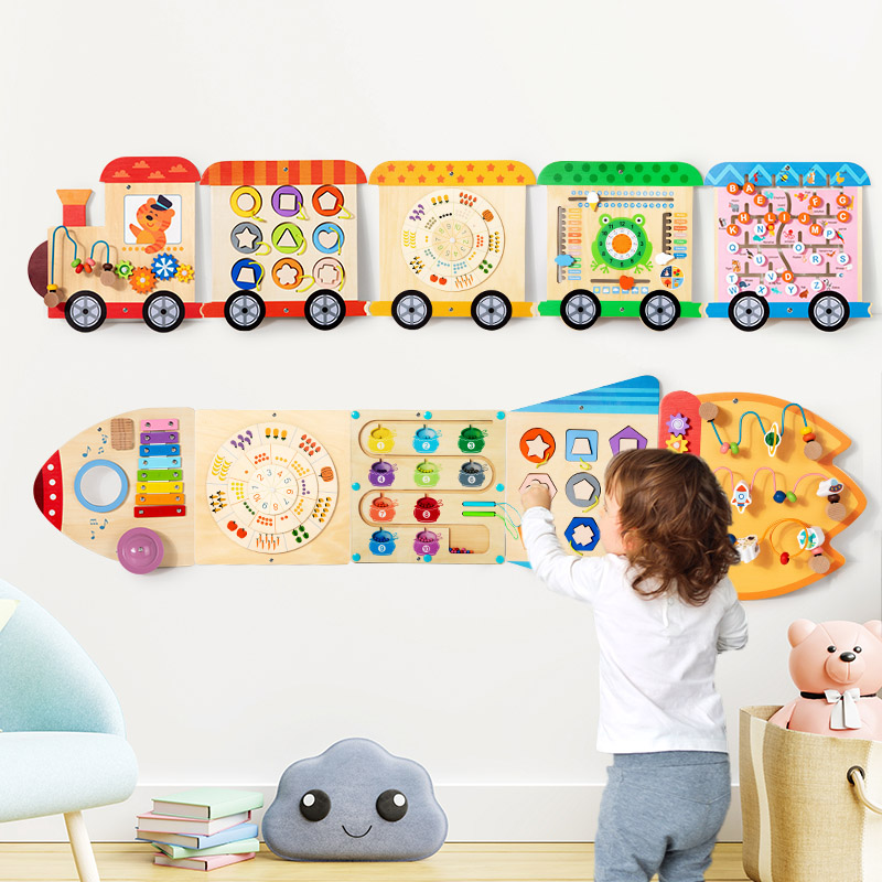 Train-style and rocket-style Montessori early education toys exercise babies' hands and brain. Kindergarten family wall games. Children's corner games in the kindergarten full figure
