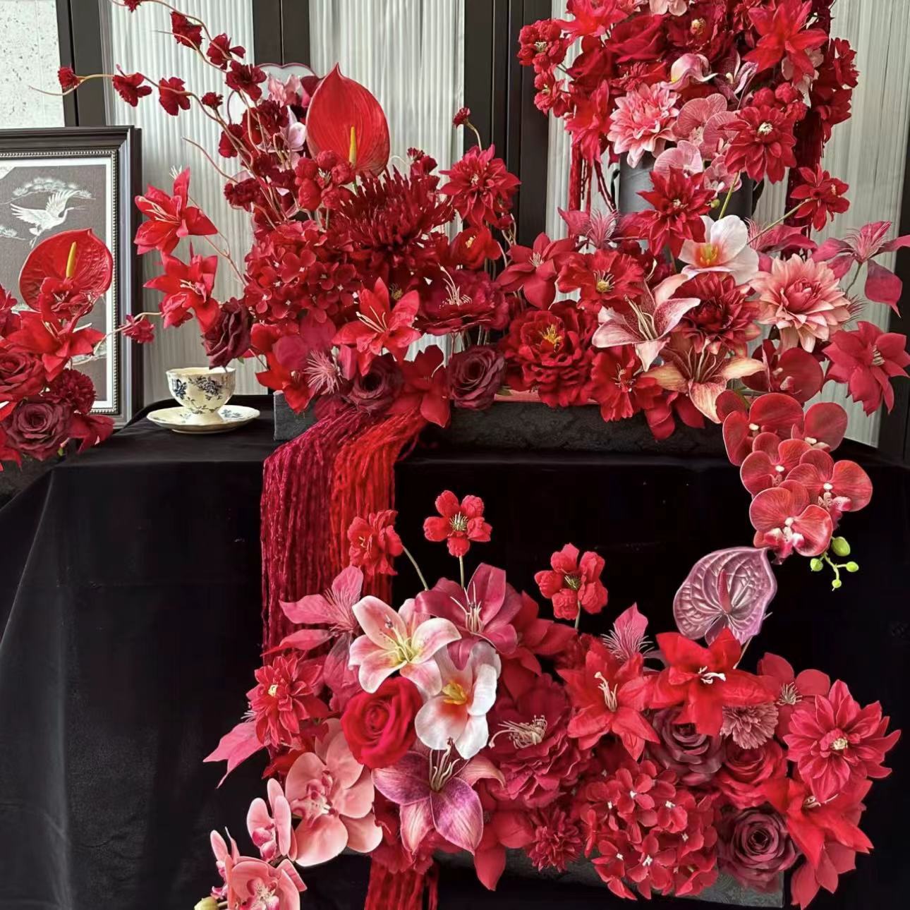 red artificial flower wedding ceremony wedding room scene layout fake flower wedding bridal party row flower arrangement hydrangea roses details Picture