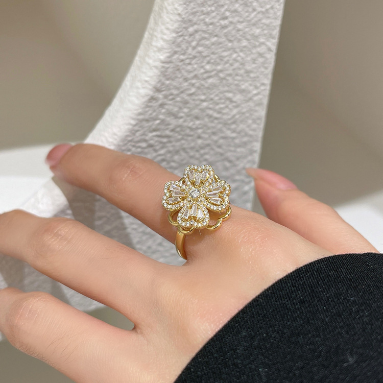 popular copper plating 18k ring rotating clover fritillary ring full diamond flowers openings adjustable index finger ring details Picture