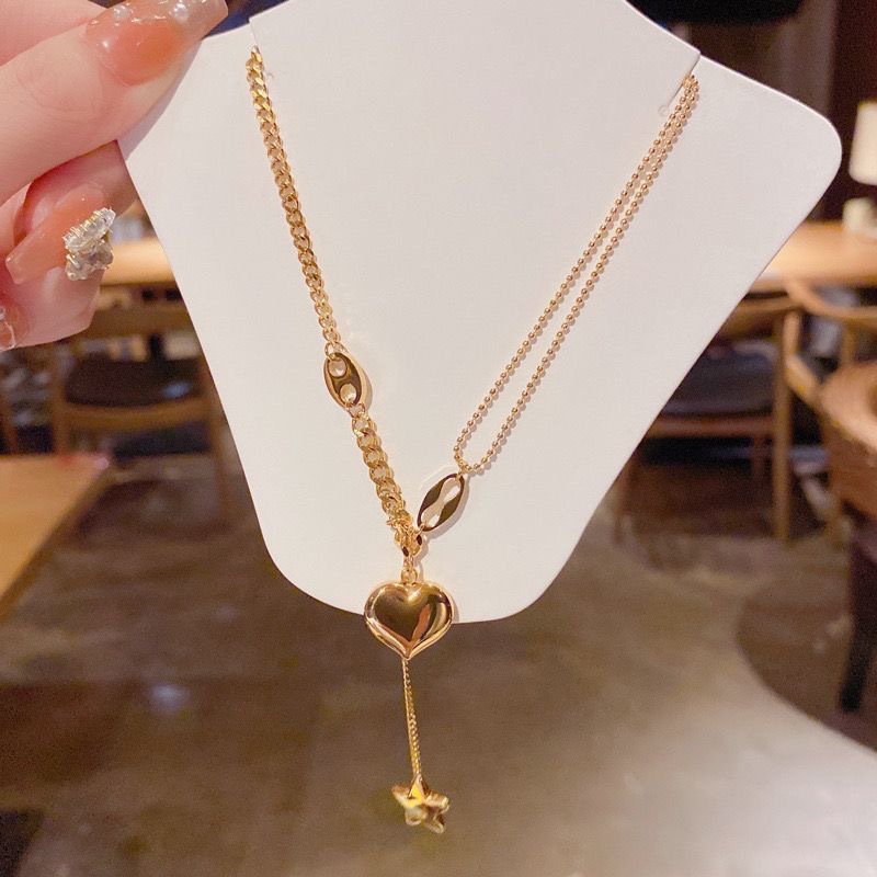 新款小星星爱心流苏项链金色简约气质钛钢项链女复古锁骨细链饰品白底实物图