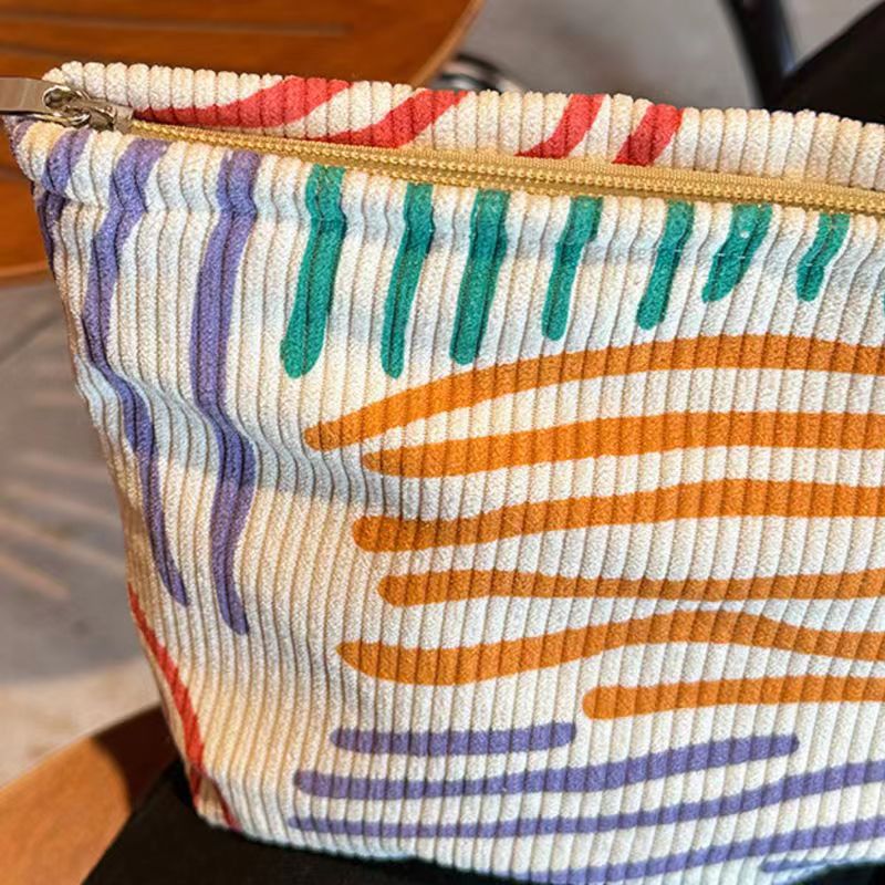 ins niche corduroy contrast color striped make-up bag portable travel travel skin care products buggy bag wash bag Specification drawing