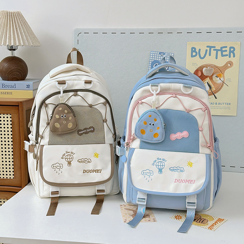 A new, cute, large-capacity, fresh and light Instagram backpack with a contrasting color school style for young girls. Spring outing schoolbag full figure