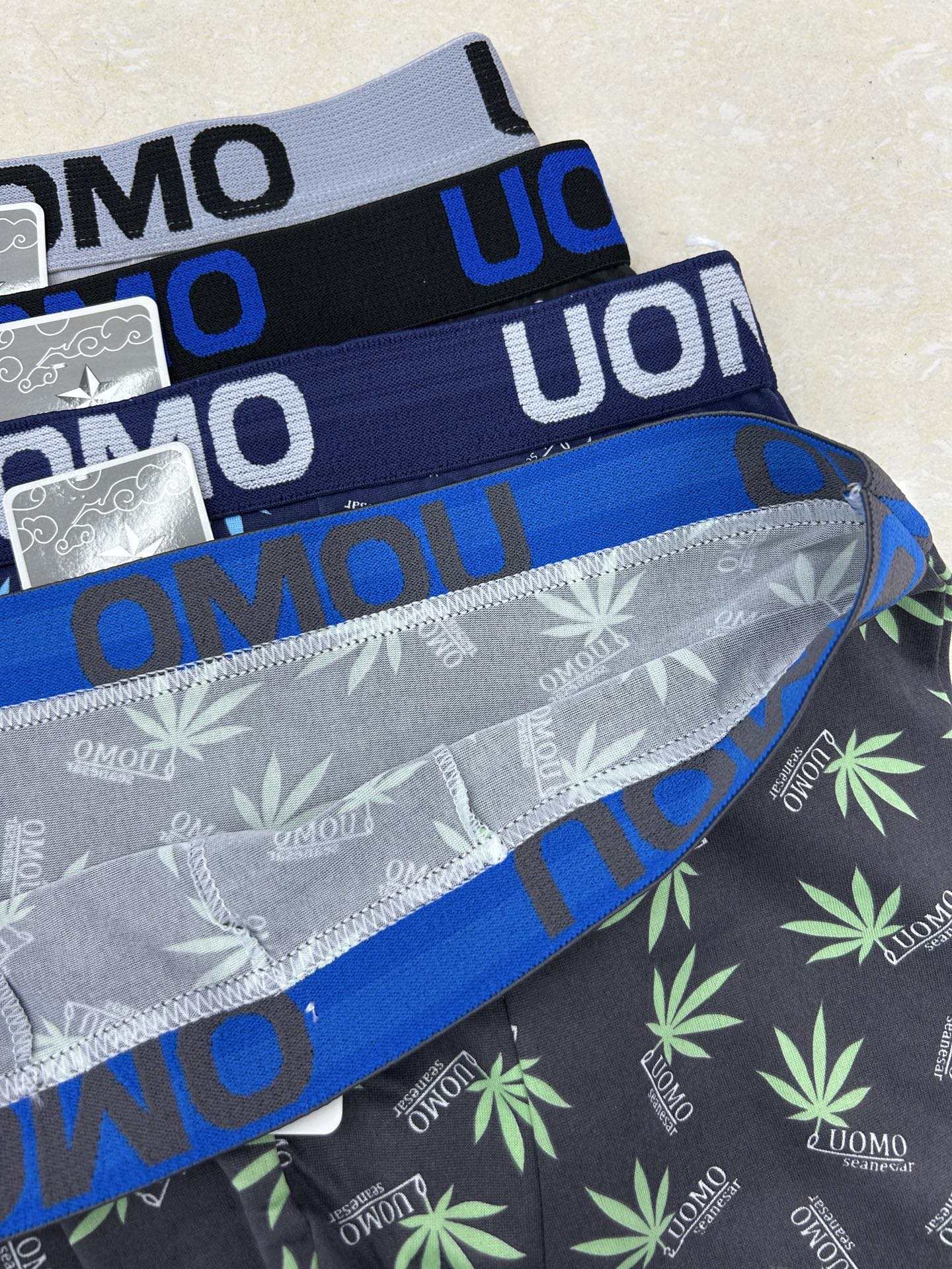 Super low price letter waist solid color men's four-corner underwear, flat underwear, comfortable flat shorts, milk silk men's underwear in stock for export to Africa Item Picture