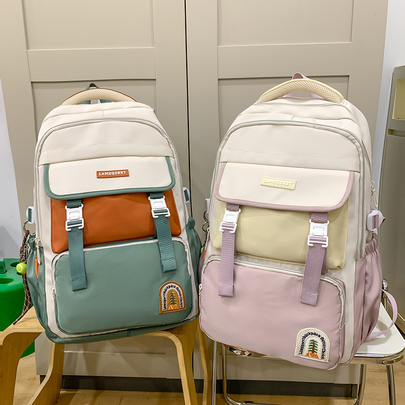 New large-capacity color-blocking schoolbag for campus students, waterproof, back-protecting, durable and lightweight backpack, trendy study and research backpack full figure