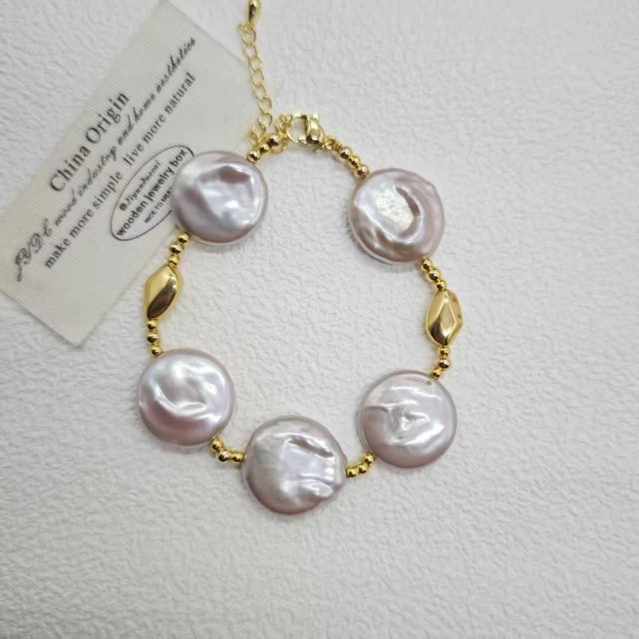 粉紫色圆片巴洛克珍珠饰品产品图