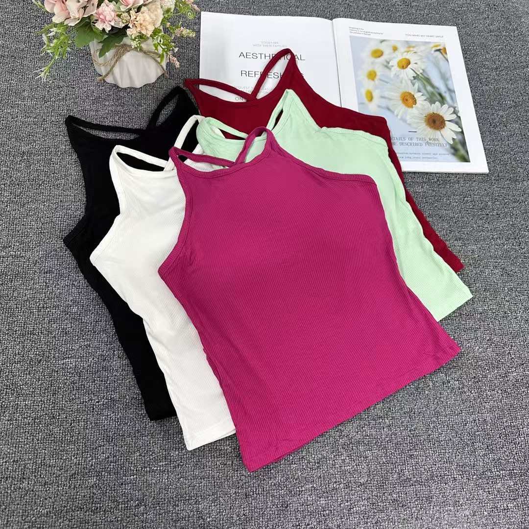 This is an export women's vest with a chest pad and an integrated beautiful back halter. It features a sexy and thoughtful backless design. The sexy small halter women's vest can be worn outside full figure