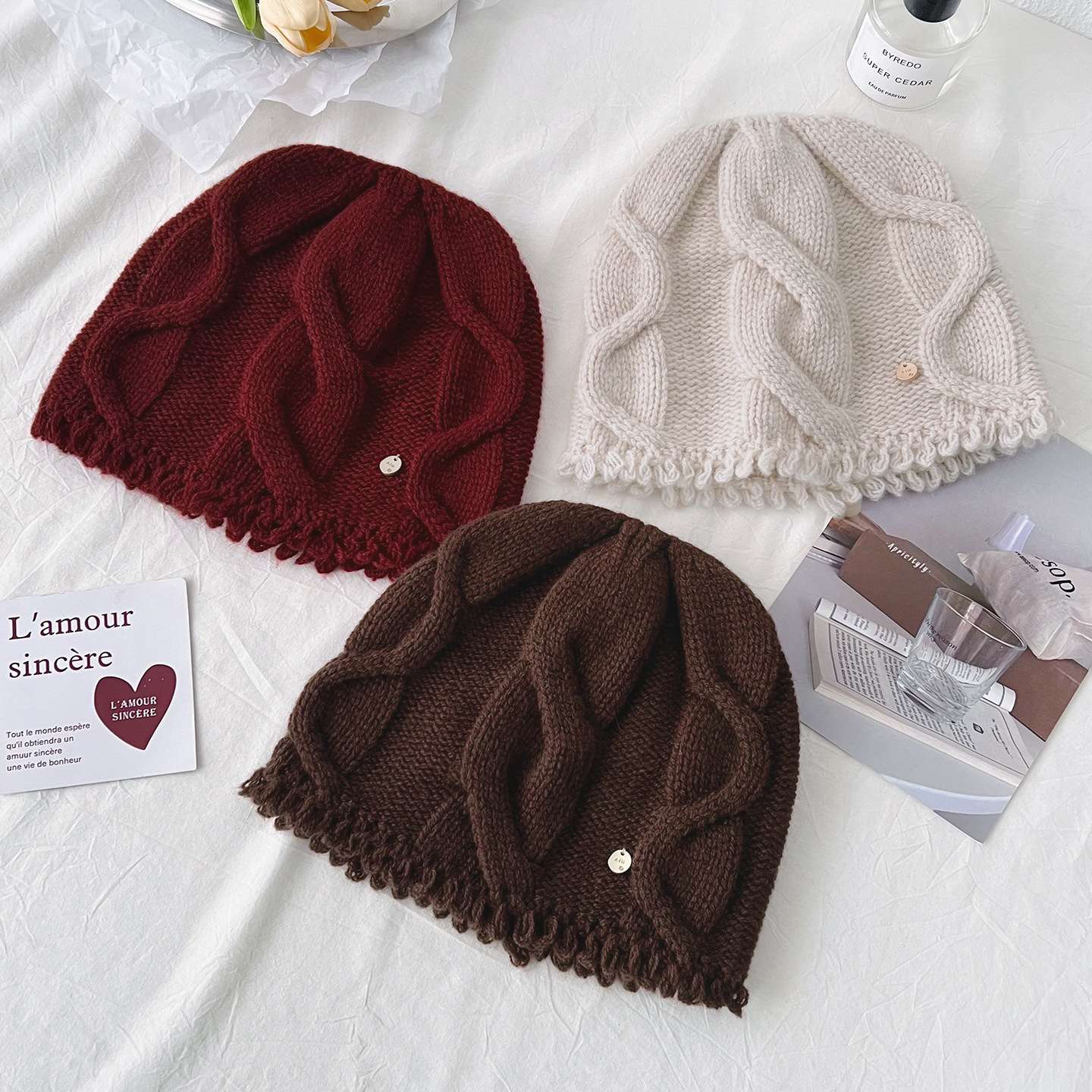 100% pure wool knitted cap for women's autumn and winter new style, making the face look smaller, warm and ear-protecting solid color twisted cold cap