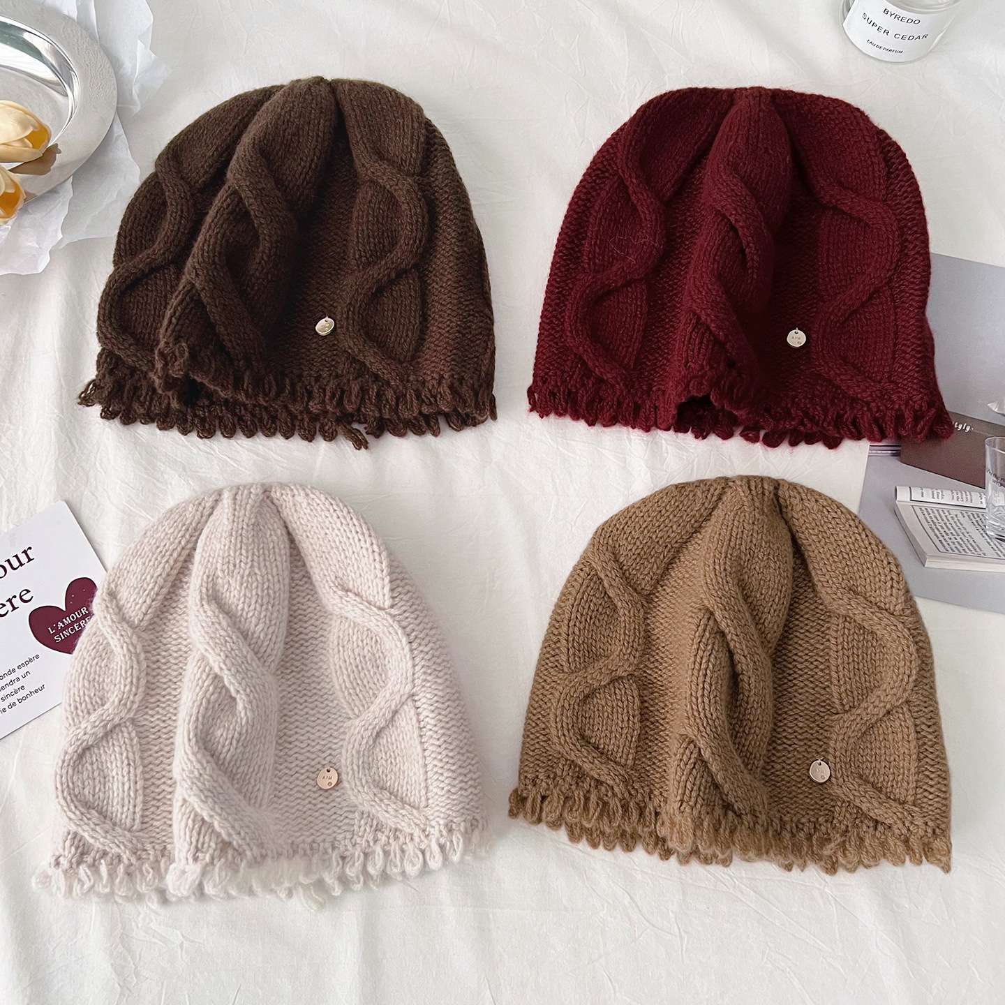 100% pure wool knitted cap for women's autumn and winter new style, making the face look smaller, warm and ear-protecting solid color twisted cold cap details Picture
