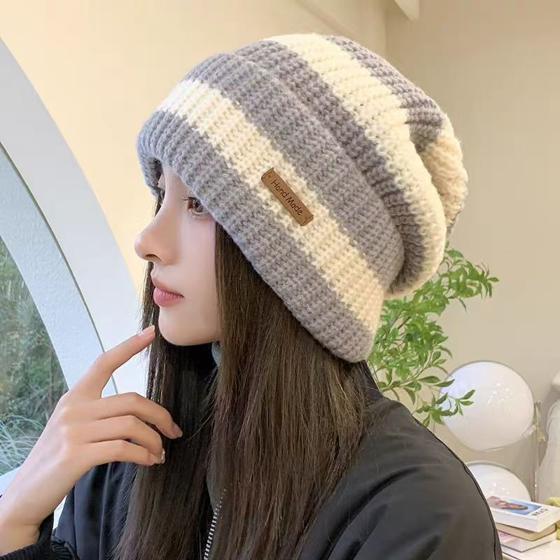 New autumn and winter versatile and fashionable large-head knitted cap, warm and ear-protecting trendy loose women's face-enhancing striped woolen cap