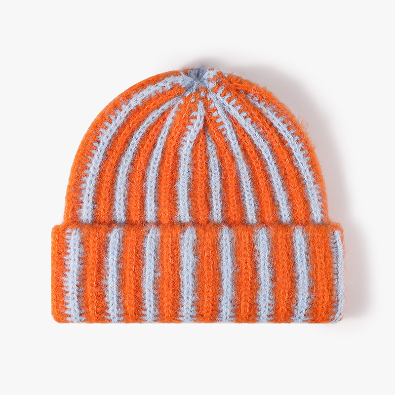 Korean-style color-blocking striped double-layer knitted cap with thickened design, versatile and fashionable for autumn and winter. ins rolled-up woolen cap pairs well with women Application Scenario