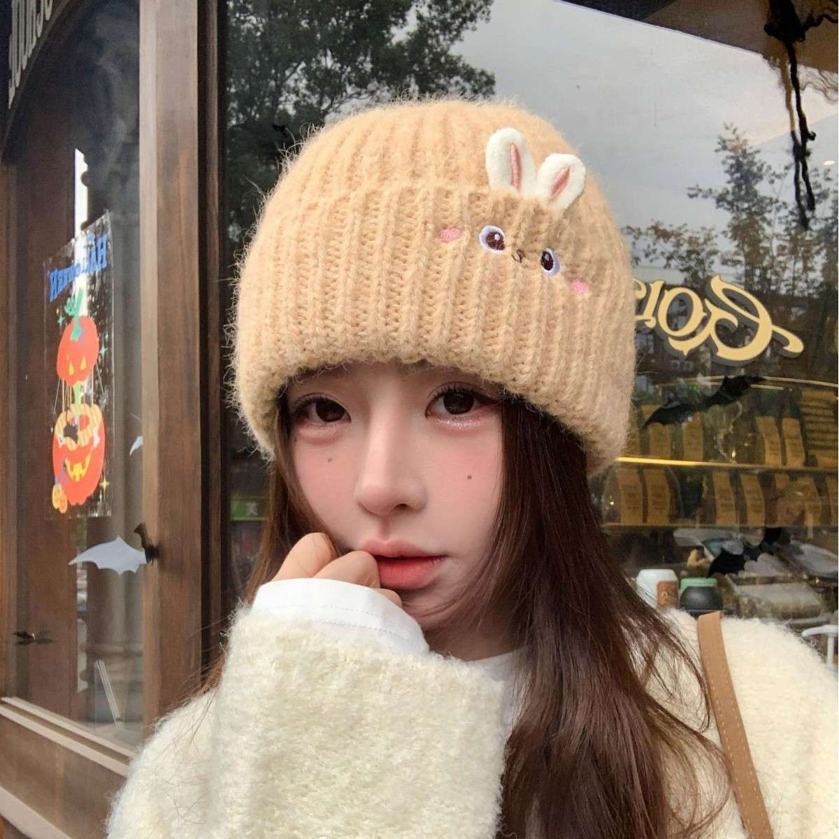 A new winter style of warm and cute rabbit knitted cap for women, casual and versatile, thickened warm ear-protecting simple woolen cap Application Scenario