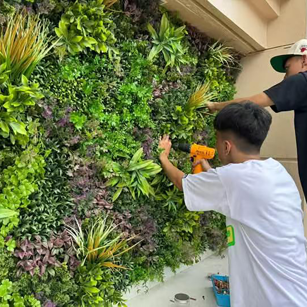 Wholesale customization of artificial plant background walls for indoor and outdoor company and shopping mall decoration, artificial green plants, flowers, fences, landscaping, green plant decoration, and lawns Application Scenario