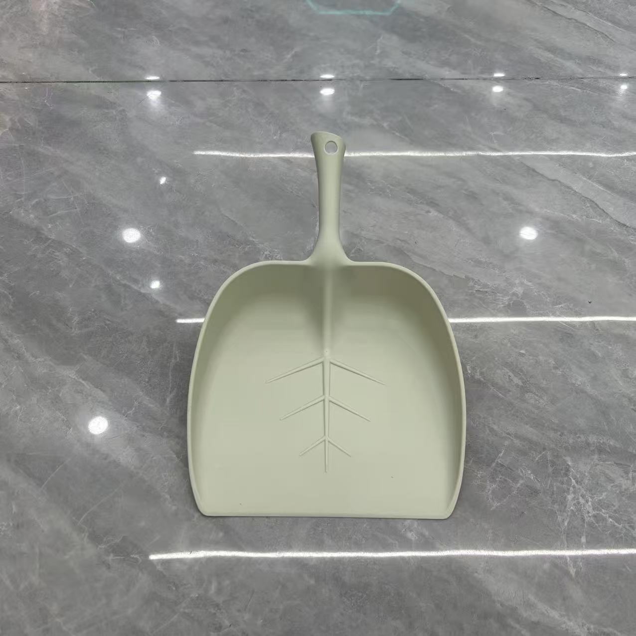 Light green leaf pattern dustpan, realistic flower arrangement, succulent simulation flower micro-landscape, handcrafted moss and green plant decoration, broom and dustpan