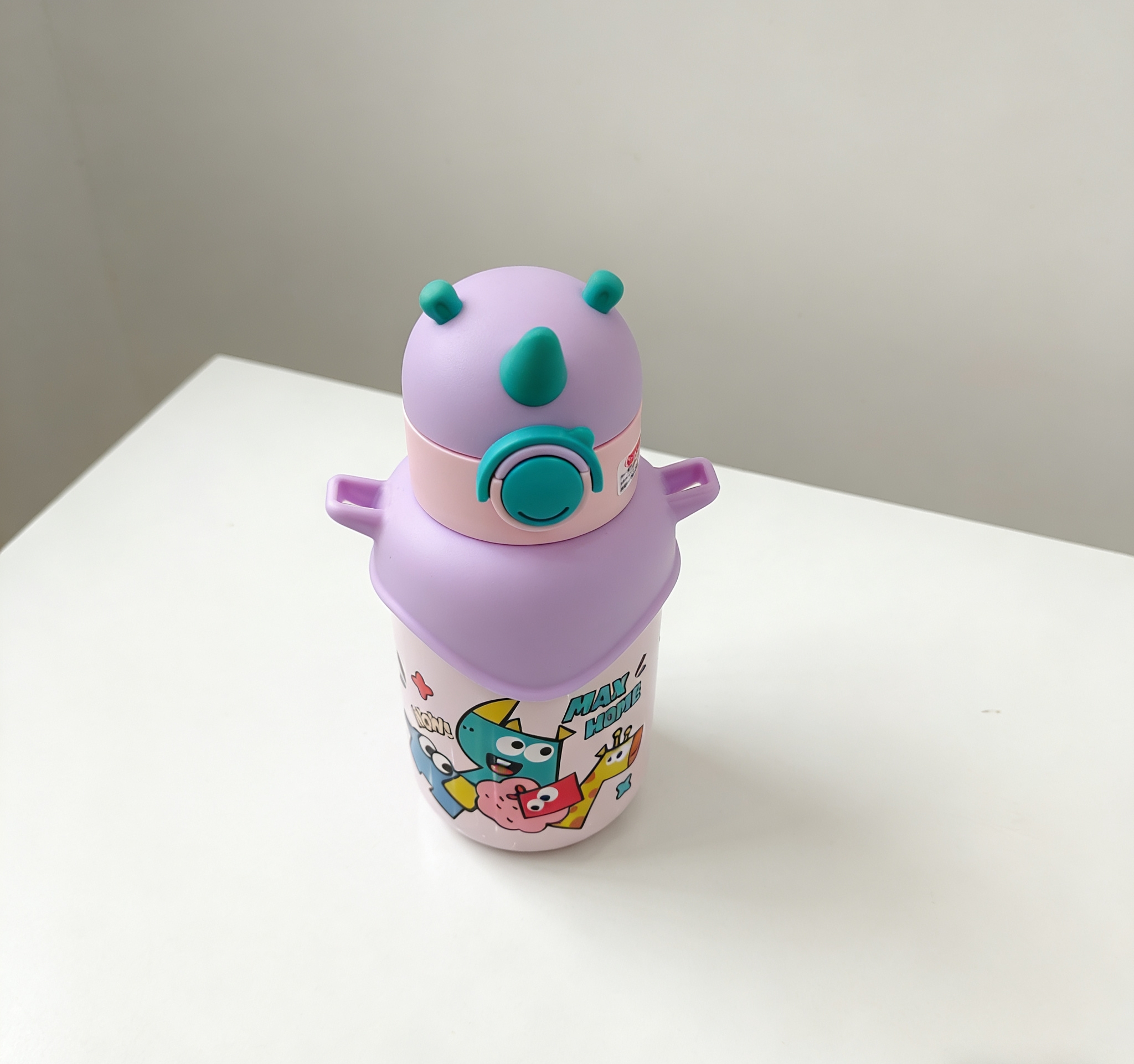 Cartoon pattern dinosaur-shaped children's stainless steel insulated cup with double-ear handle, portable straw insulated water cup wholesale Item Picture