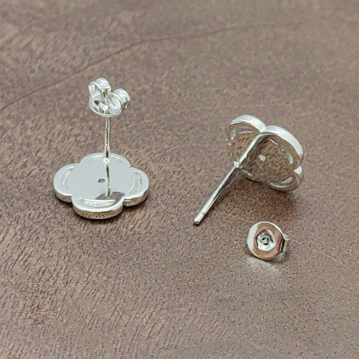 Silver flower-shaped ear stud accessories, earrings, ear sticks, multiple pairs, simple and versatile, fashionable women's style, white zirconium four-petal flower ear stud silver needles Application Scenario