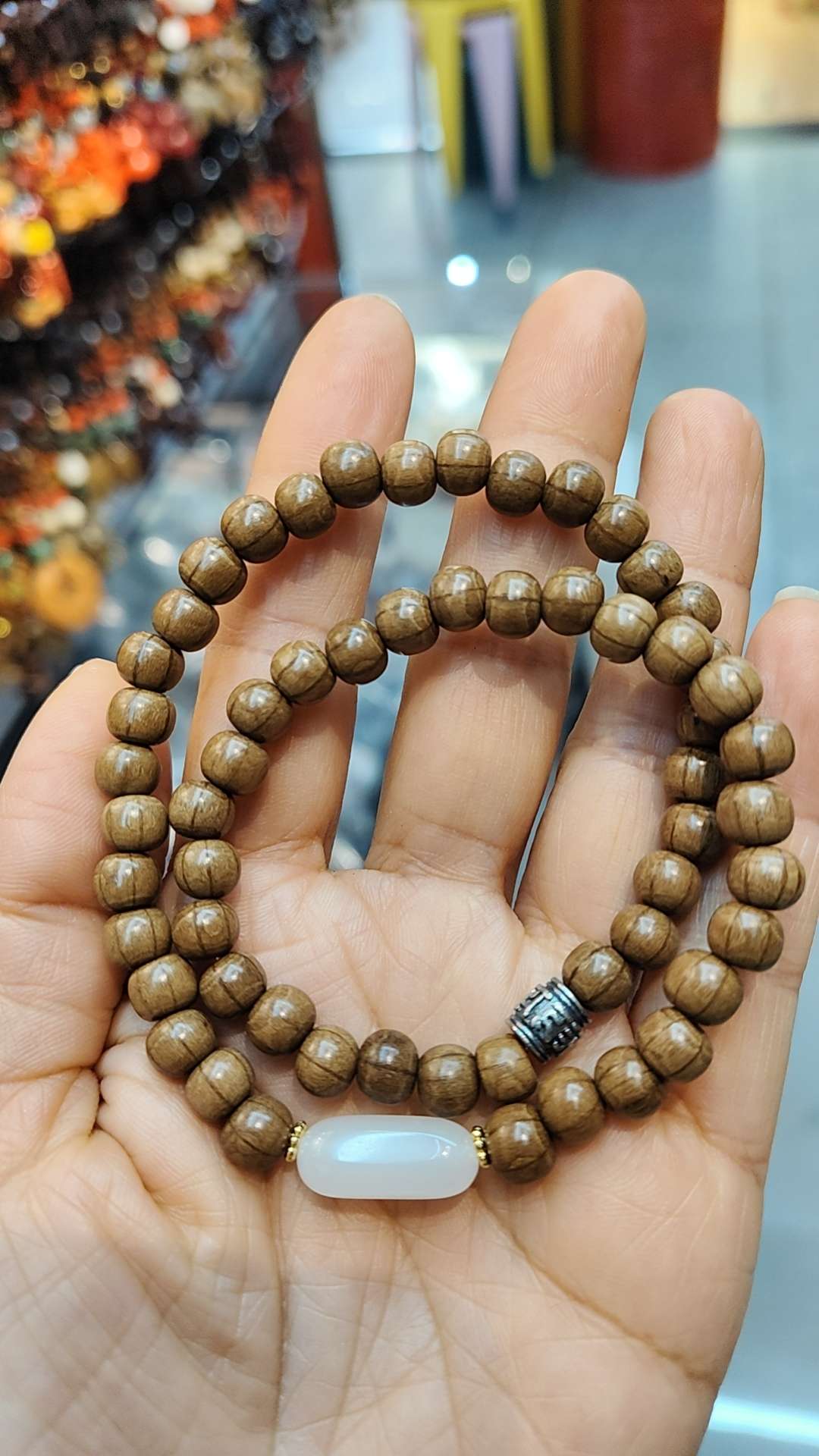 A double-loop bracelet made of six kinds of wood, Hetian jade and Sanqi silver