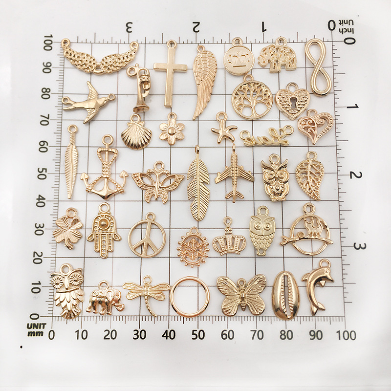 Aliexpress alloy kc gold diy jewelry accessories, earrings, bracelets, necklaces, pendants and pendants are mixed in 110 pieces per package details Picture