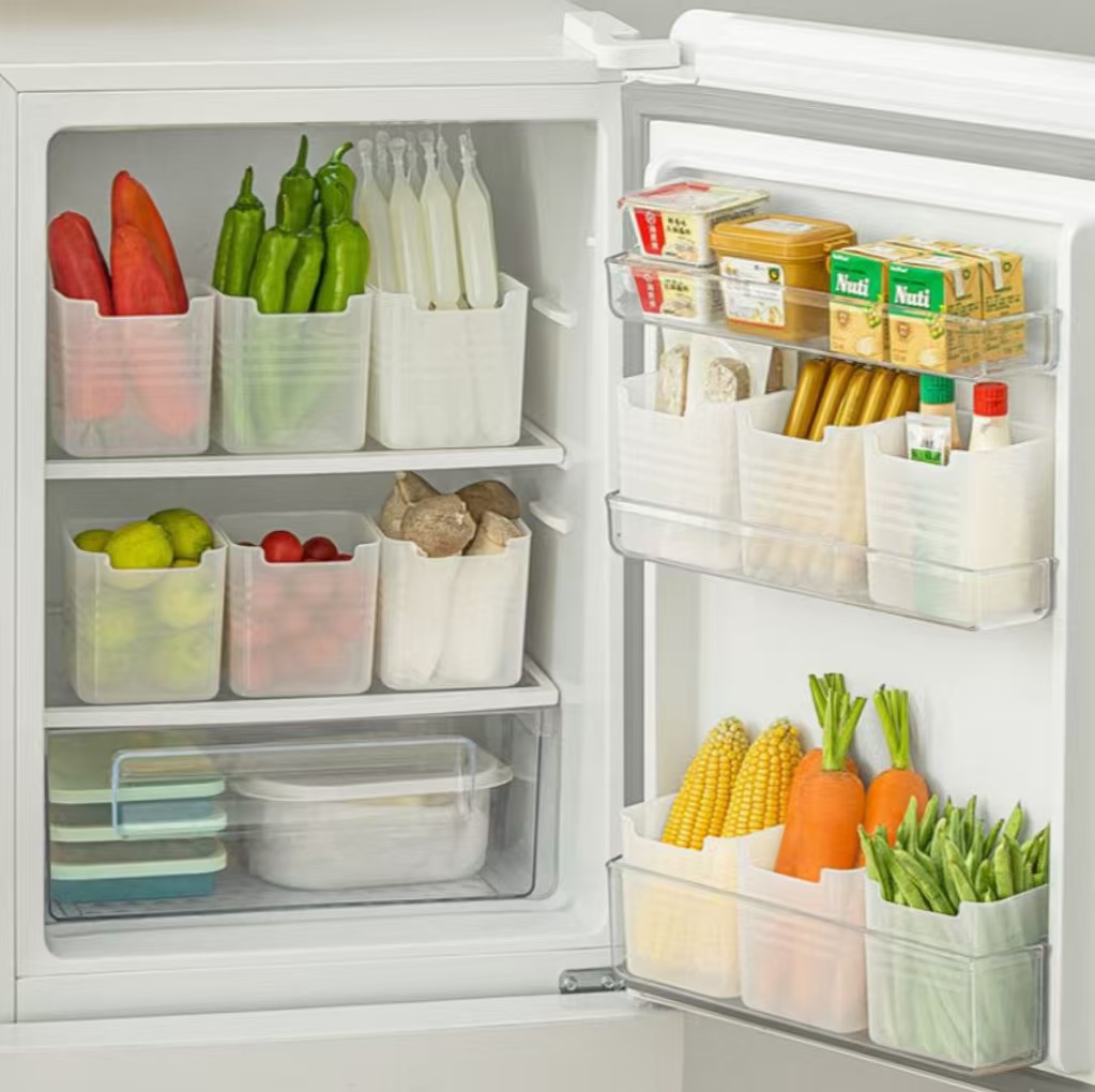 A spacious and multifunctional storage box for fruits and vegetables on the side of a refrigerator, suitable for home use. full figure