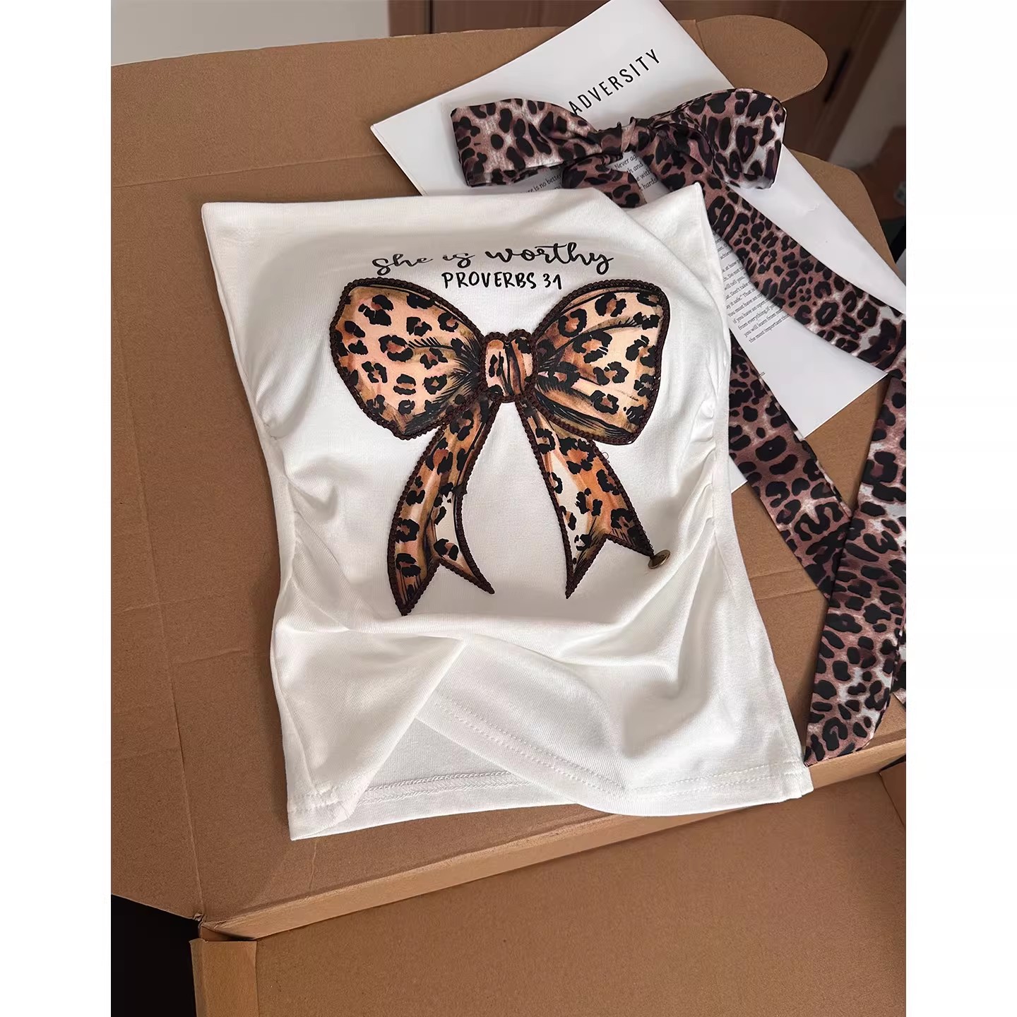 A new Korean-style anti-aging bow print halter top for women, with a unique design sense, is loose and slimming, and is a versatile top that is trendy Item Picture